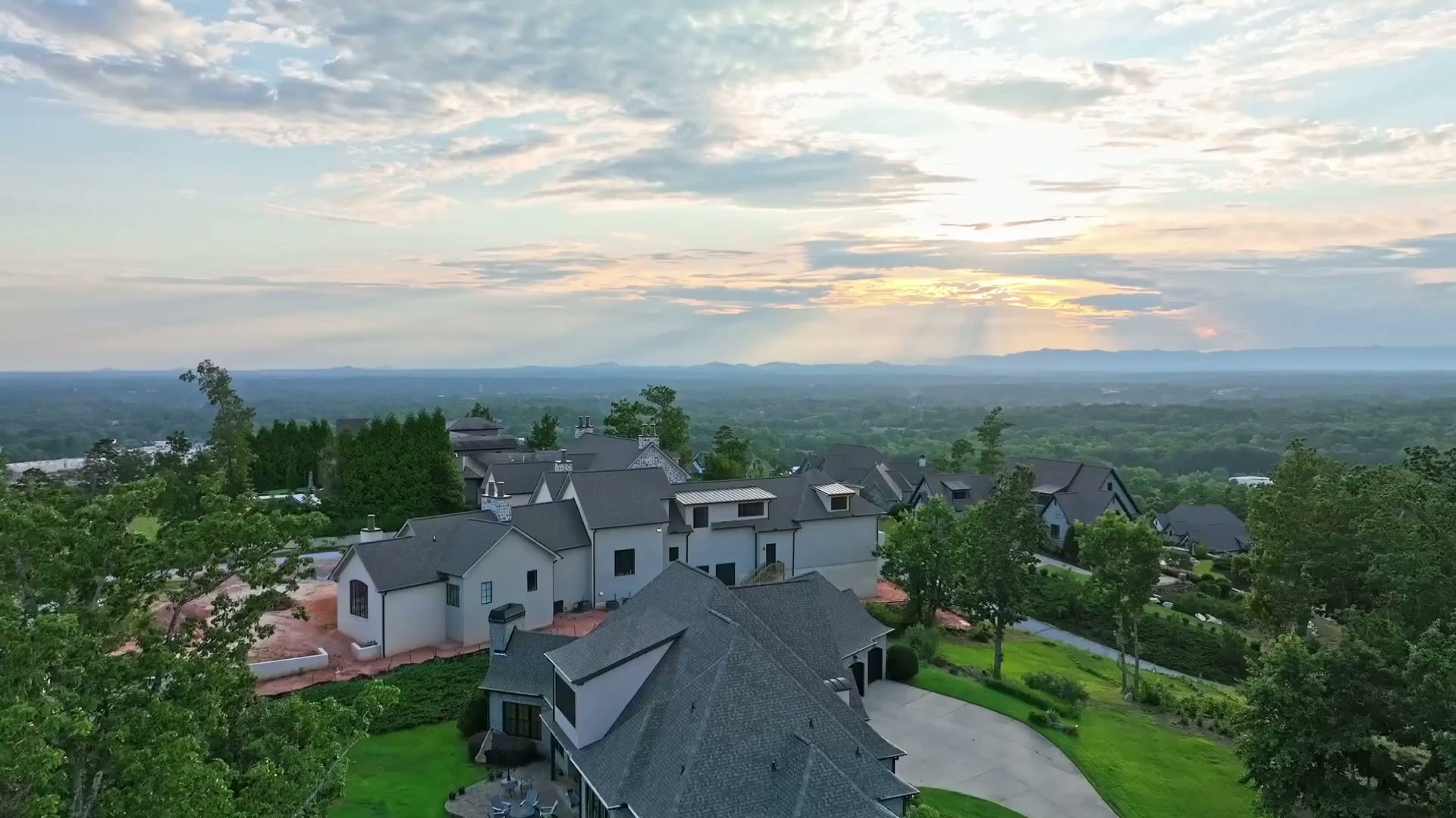 Aerial over rolling North Carolina Blue Ridge ridgelines and forested mountain estates